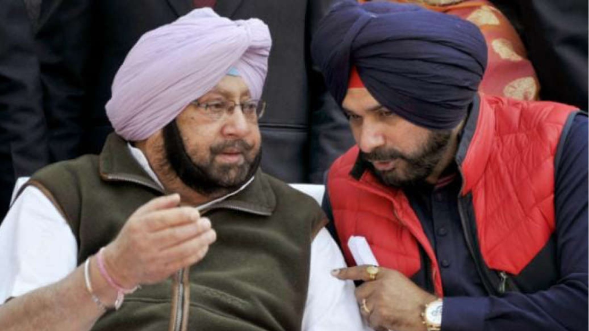 FLANKED BY CAPTAIN, SIDHU BEGINS NEW INNINGS WITH A ‘BIG HIT’ GESTURE