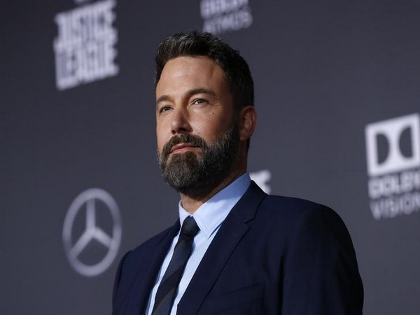 Ben Affleck balances packages, coffee while attempting to keep pants up