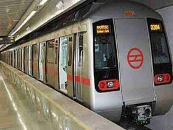 Woman jumps in front of metro train