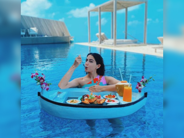 Sara Ali Khan stuns in multi-coloured bikini, enjoys floating breakfast during trip