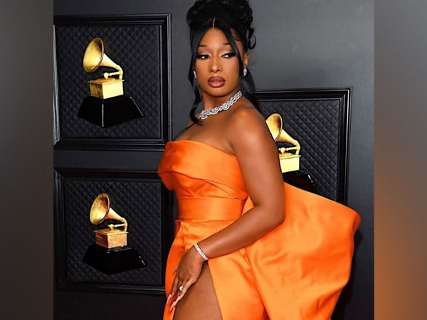 Megan Thee Stallion stuns in orange gown at 2021 Grammys