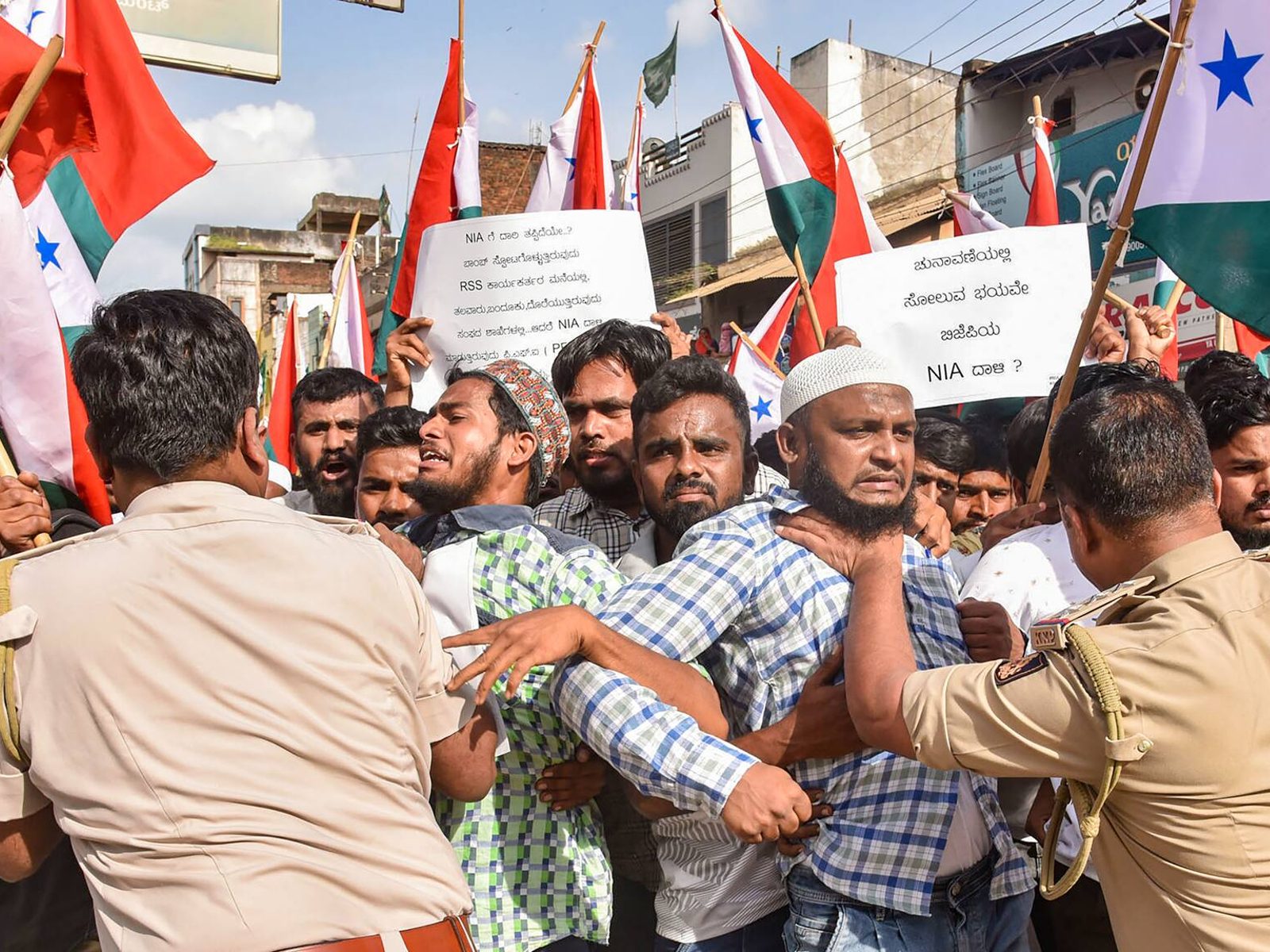 People protesting on PFI ban