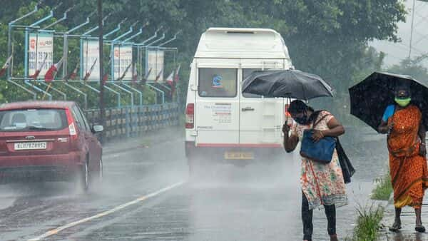 Rain stops commuters in Delhi because of waterlogged roads, uprooted trees and water filled potholes