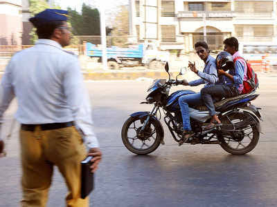 Biker without  helmet slams into constable when asked to halt