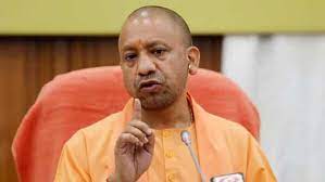 UP CM Yogi carries Sikh holy book on Veer Bal Diwas