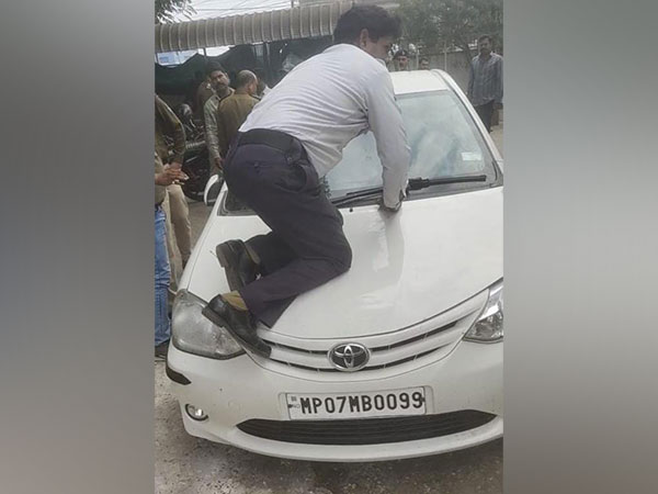 Asked to stop, car driver hits traffic police, carries him 4 km on bonnet