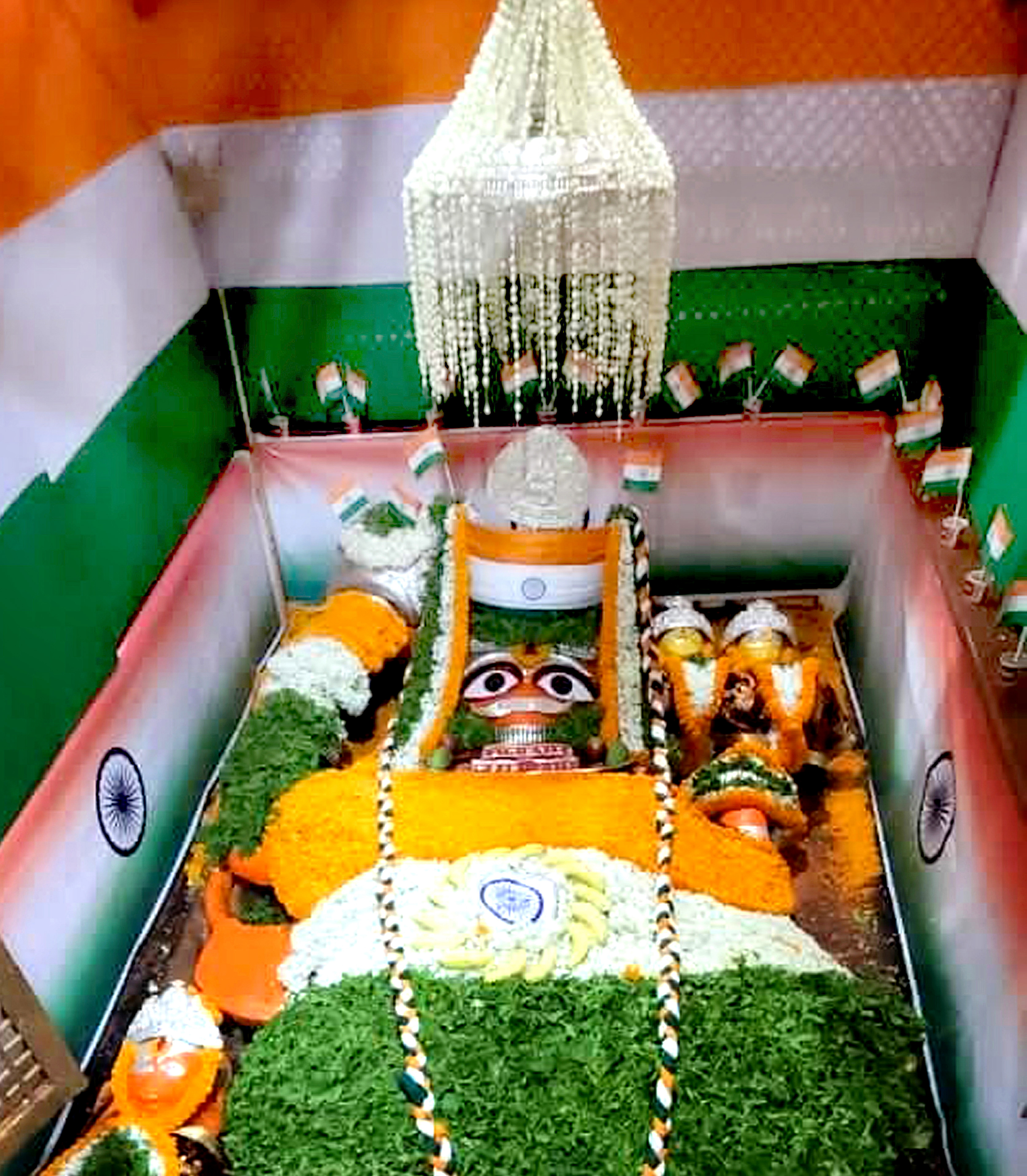 A reclining idol of Lord Hanuman adorned in the colours of National Flag