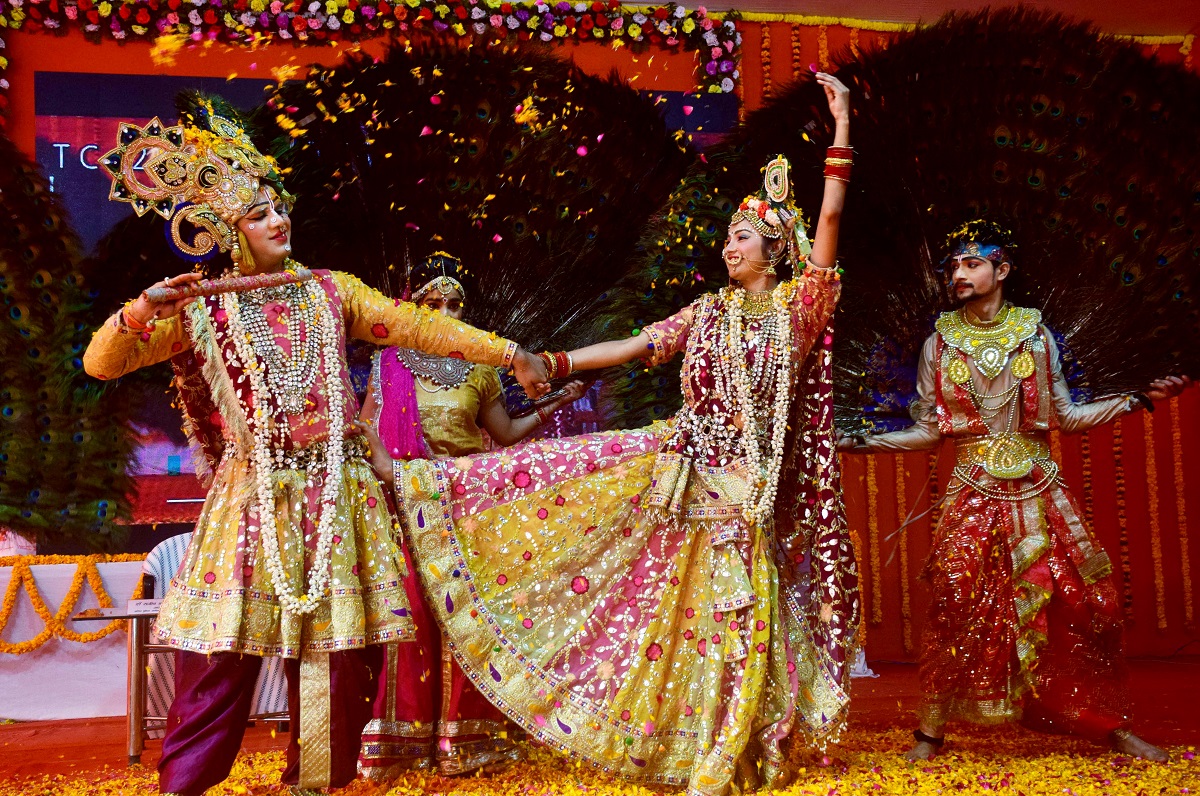 Artists perform an act ‘Braj Ki Holi’ during Magh Mela festival