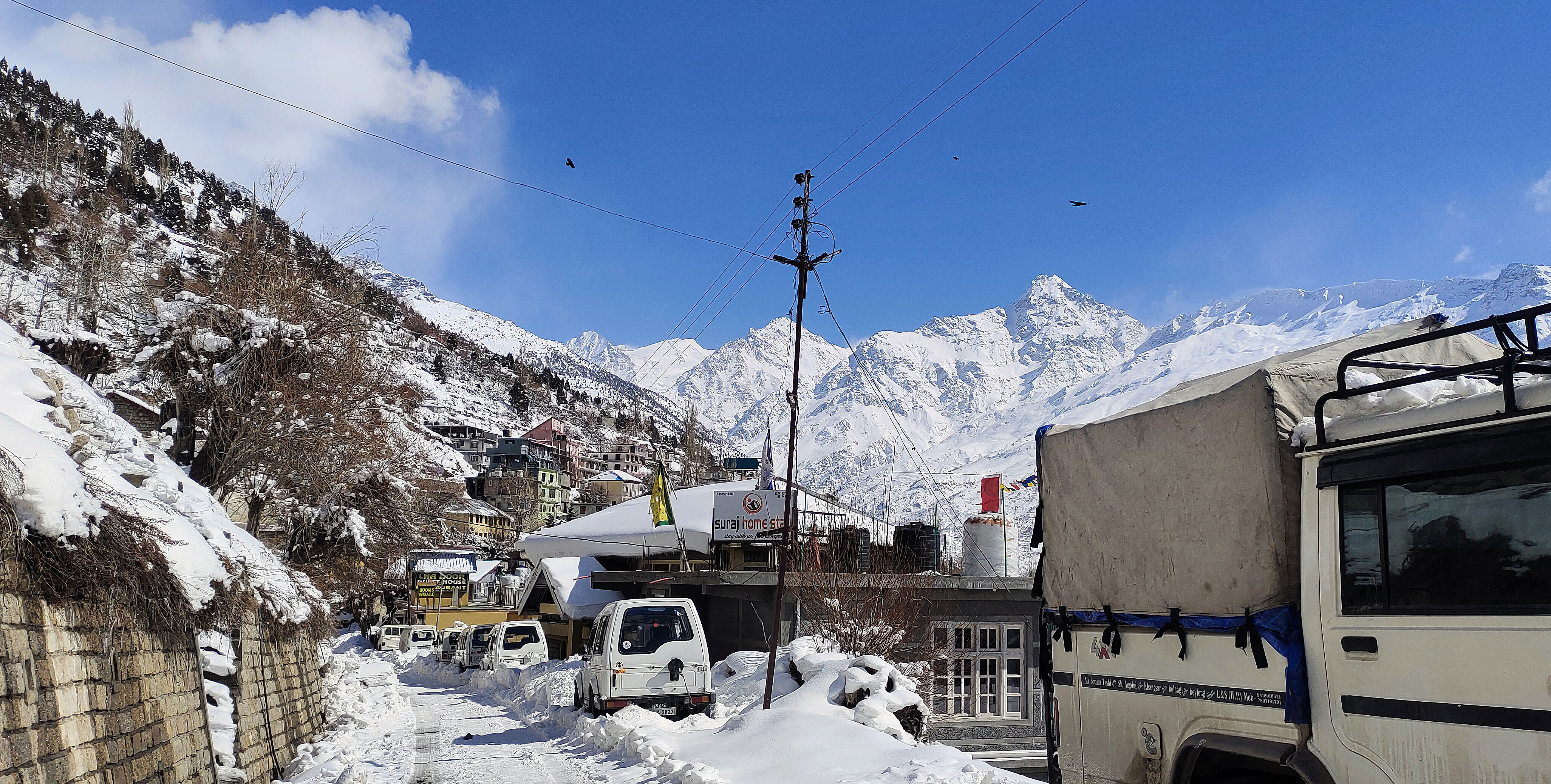 Vehicles stuck on the snow-covered bylane of Keylong