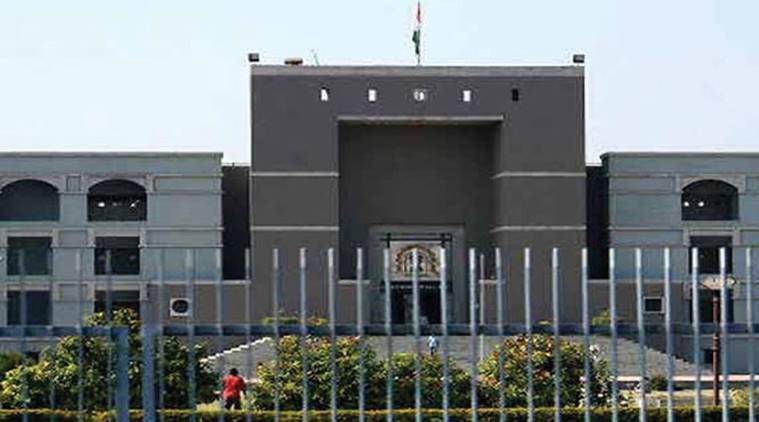 Gujarat High Court restrained police for filing chargesheet against lawyer accused of threatening government official