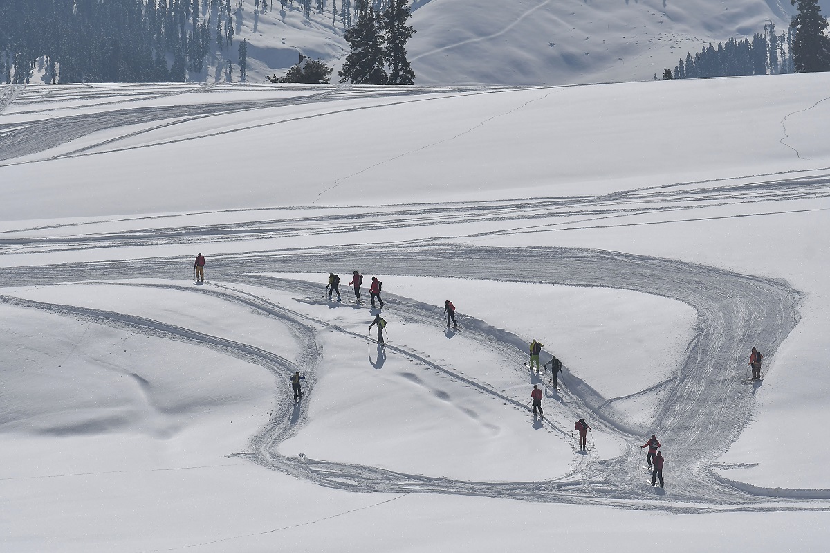 Skiers go down the snow-covered slopes at ski resort in Kangdori