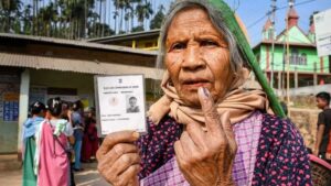 An Women shows his inked finger after casting his vote during Meghalaya Assembly Election