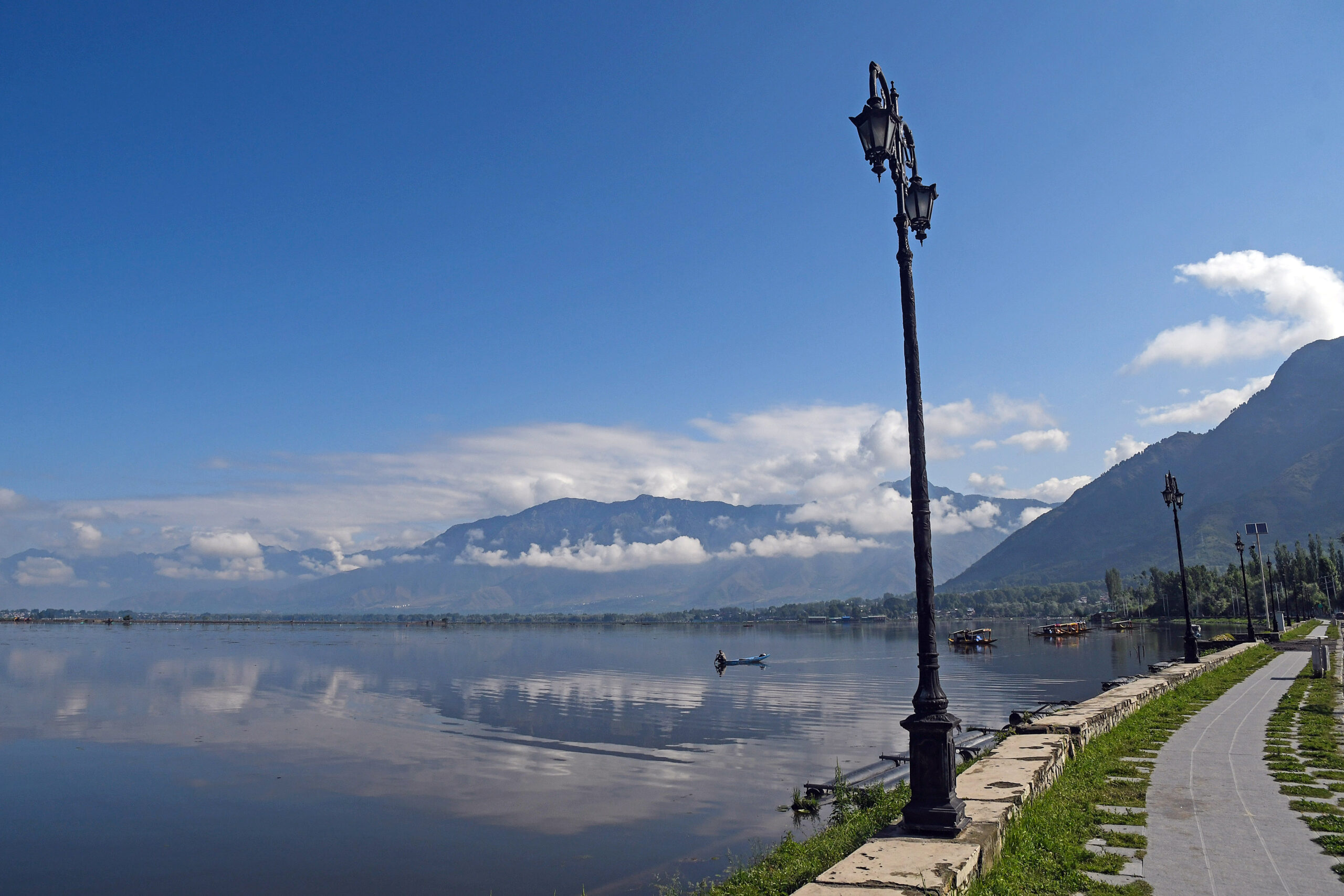 A view of Dal lake against backdrop of mountains