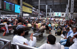 Passengers wait for southbound trains to resume at Howrah