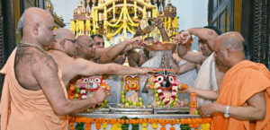 Priests perform bathing ceremony of Lord Jagannath, Devi Subhadra, and Lord Balabhadra on Deva Snana Purnima