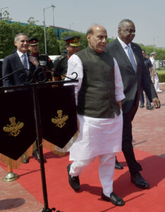 Rajnath Singh receives Lloyd Austin on his arrival to inspect Tri-Services Guard of Honour