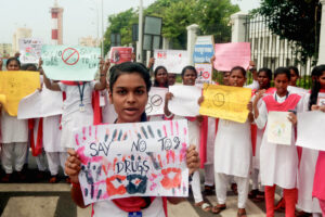 Students display placards for awareness campaign on International Day against Drug Abuse