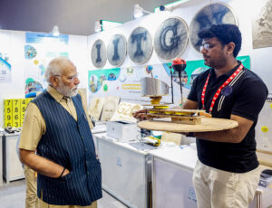 PM Narendra Modi visits an exhibition at the inauguration of Akhil Bhartiya Shiksha Samagam