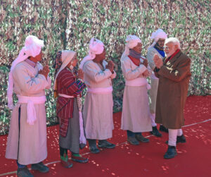 Prime Minister Narendra Modi being greeted by people at Gunji Village