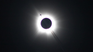 Total Solar Eclipse Photo with Passing Plane Goes Viral