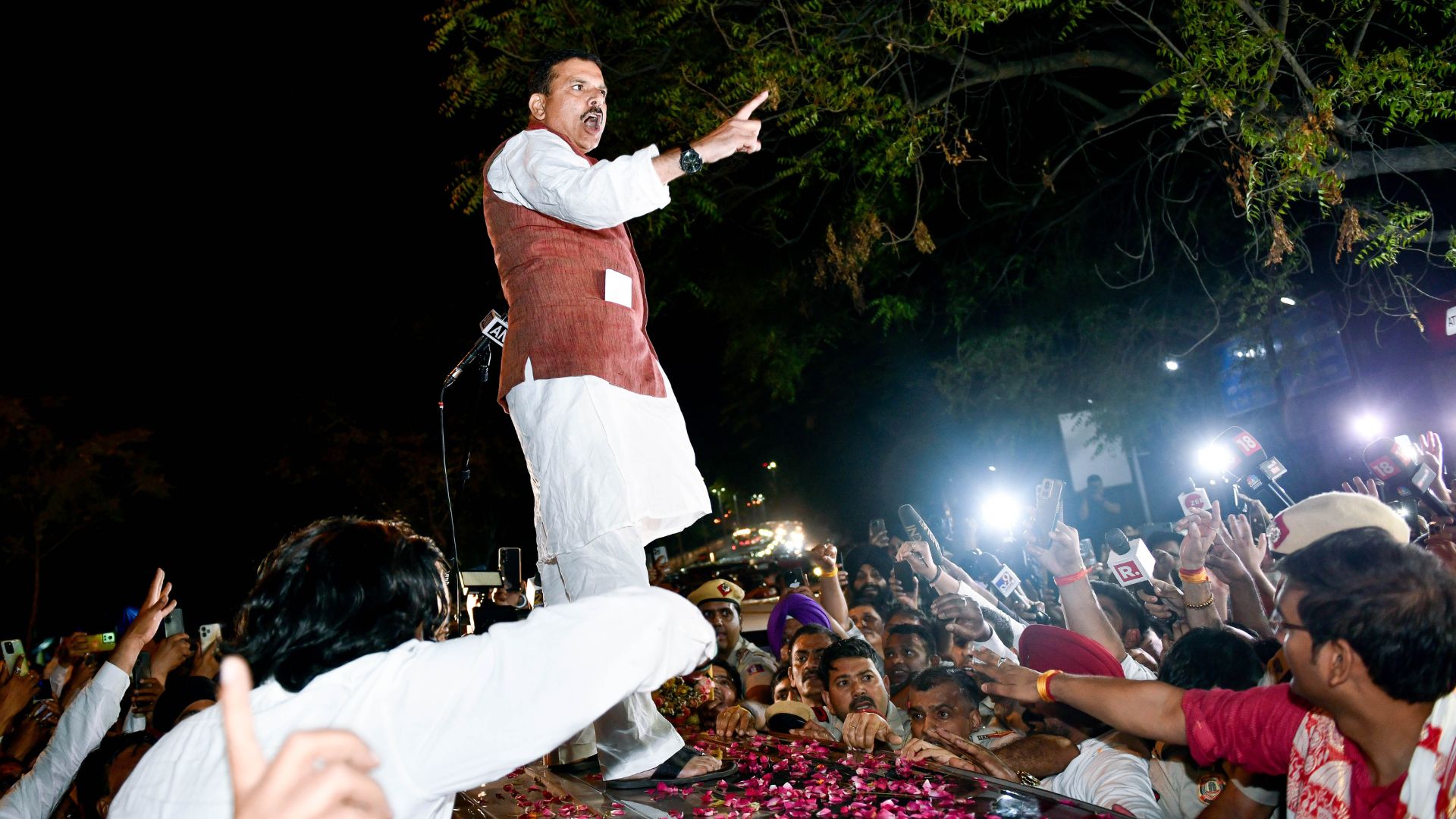 AAP MP Sanjay Singh addresses party workers as he walks out of Tihar Jail