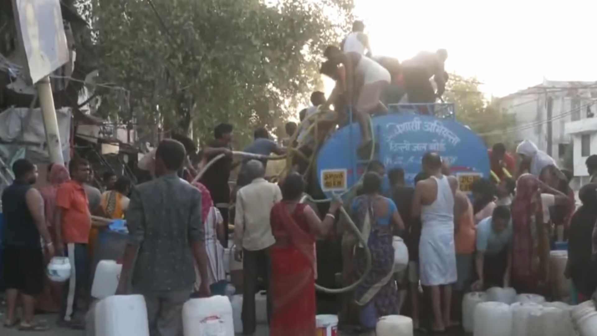 Desperate Residents Wait In Front Of Water Tankers