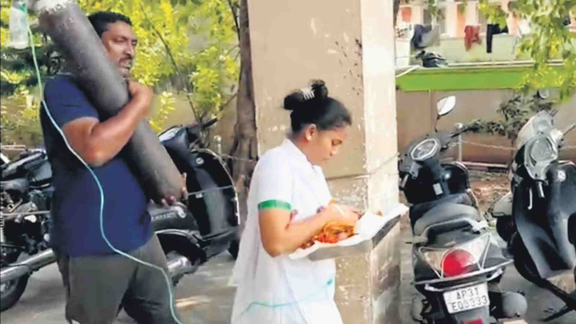 Father of Newborn Child Carries Oxygen Cylinder