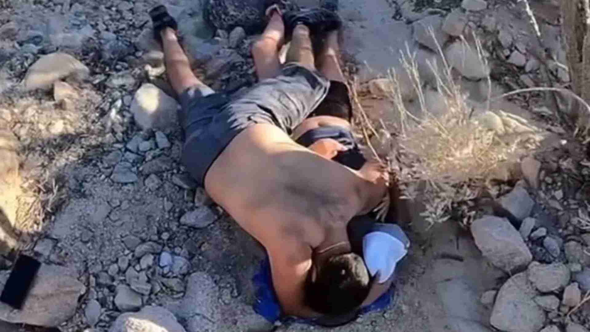 USA: Man Protects His Girlfriend From Scorching Sun & Wind Until Help Arrives