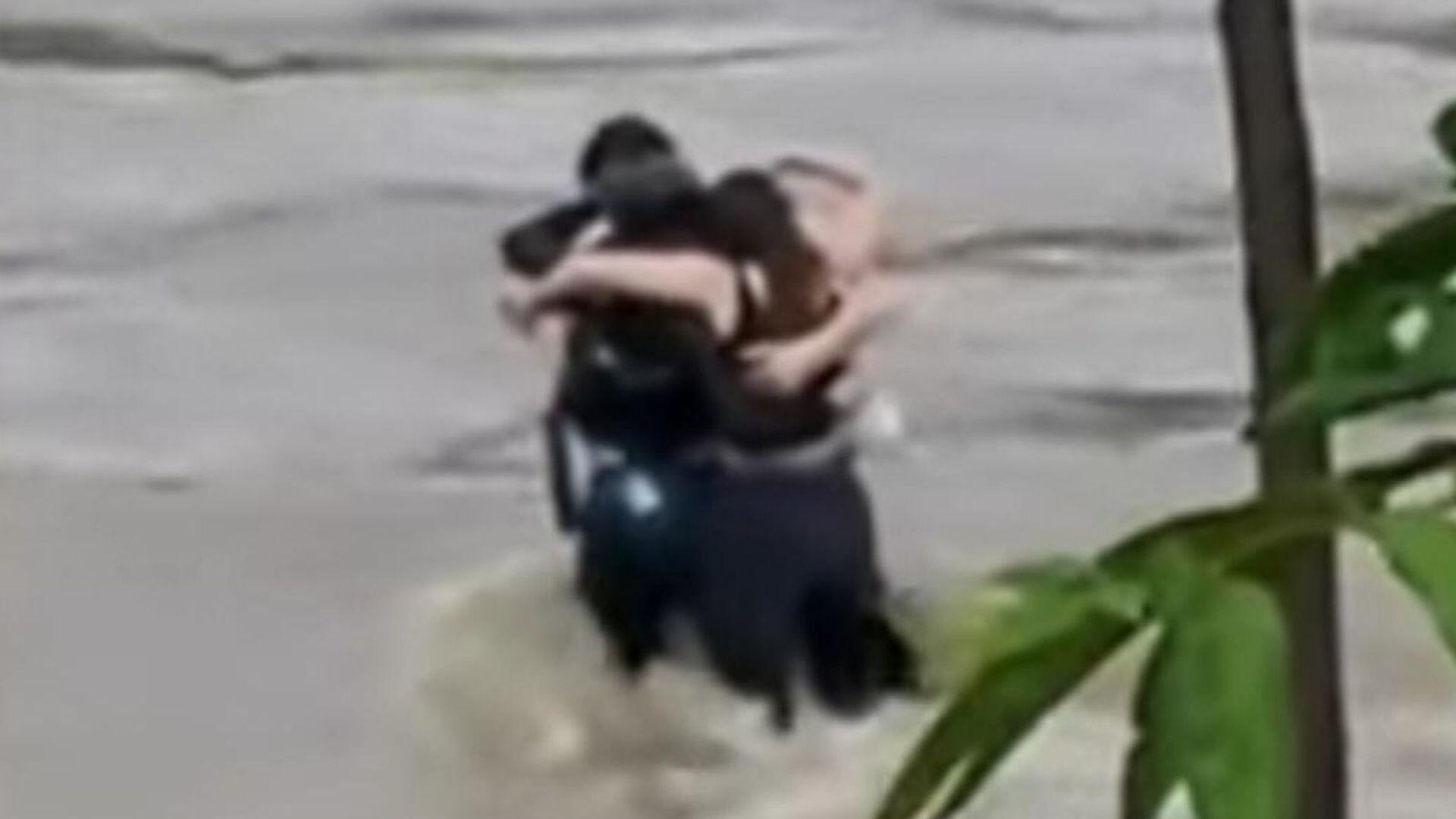 Three Friends Hug Each Other Before Being Swept Away By Italian Floodwaters