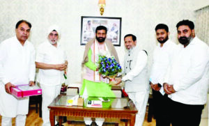 Nirankari Mission Sevadars meet CM Saini ahead of Sant Samagam