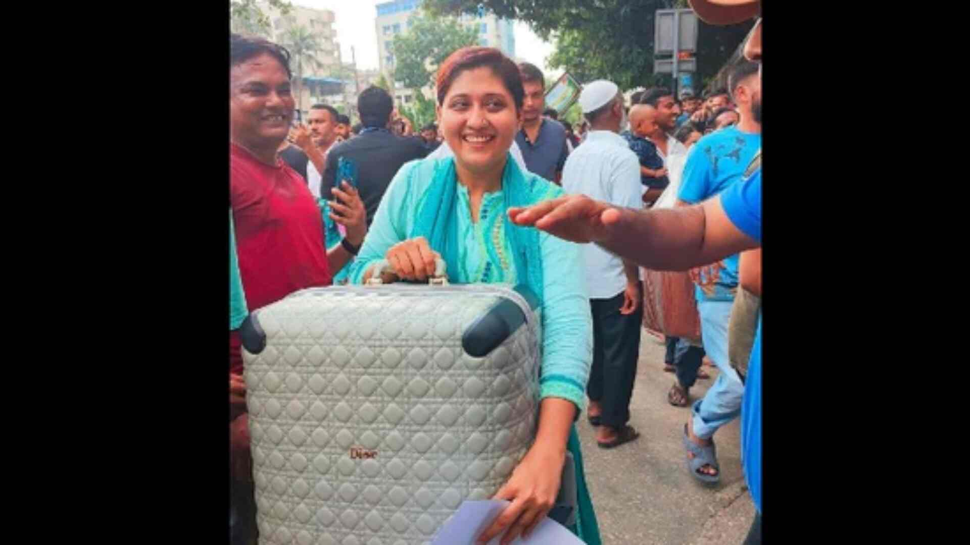 See Viral Photo: Woman In Dior Suitcase Smiles Amid Sheikh Hasina's Residence Loot