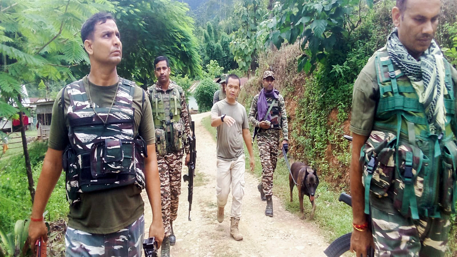 Security personnel conduct a search operation and area domination in Manipur