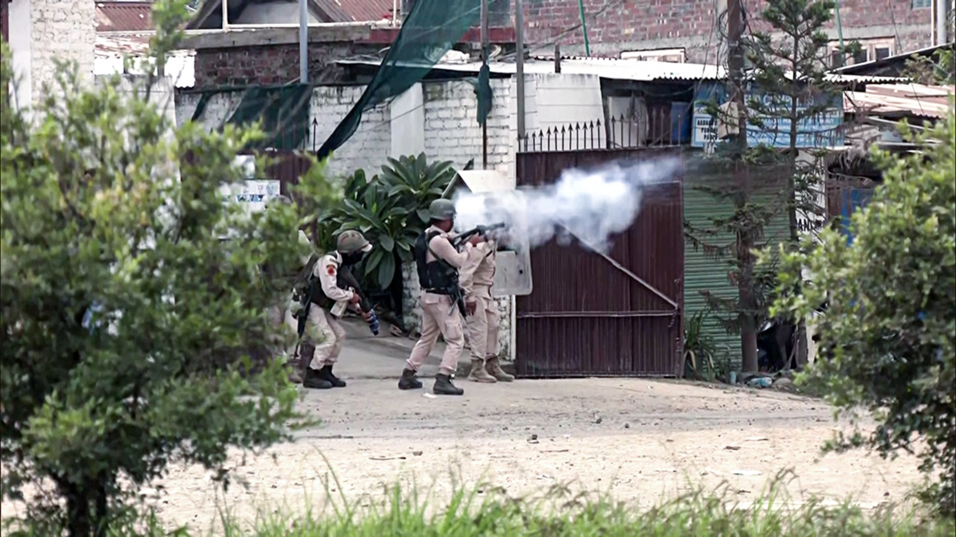 Imphal police trying to curb students protest against rising ethnic violence.