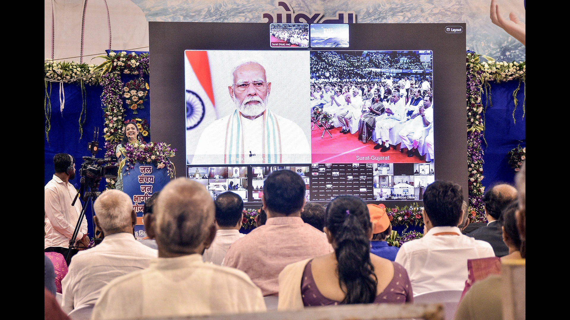 People attend the virtual launch of the 'Jal Sanchay Jan Bhagidari' initiative by PM Narendra Modi