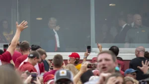 Trump’s Viral Middle Finger Photo Sparks Debate Ahead Of Iowa Polls