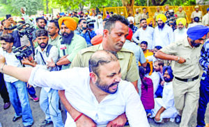 AAP leaders face water cannons during protest march over paddy lifting delay