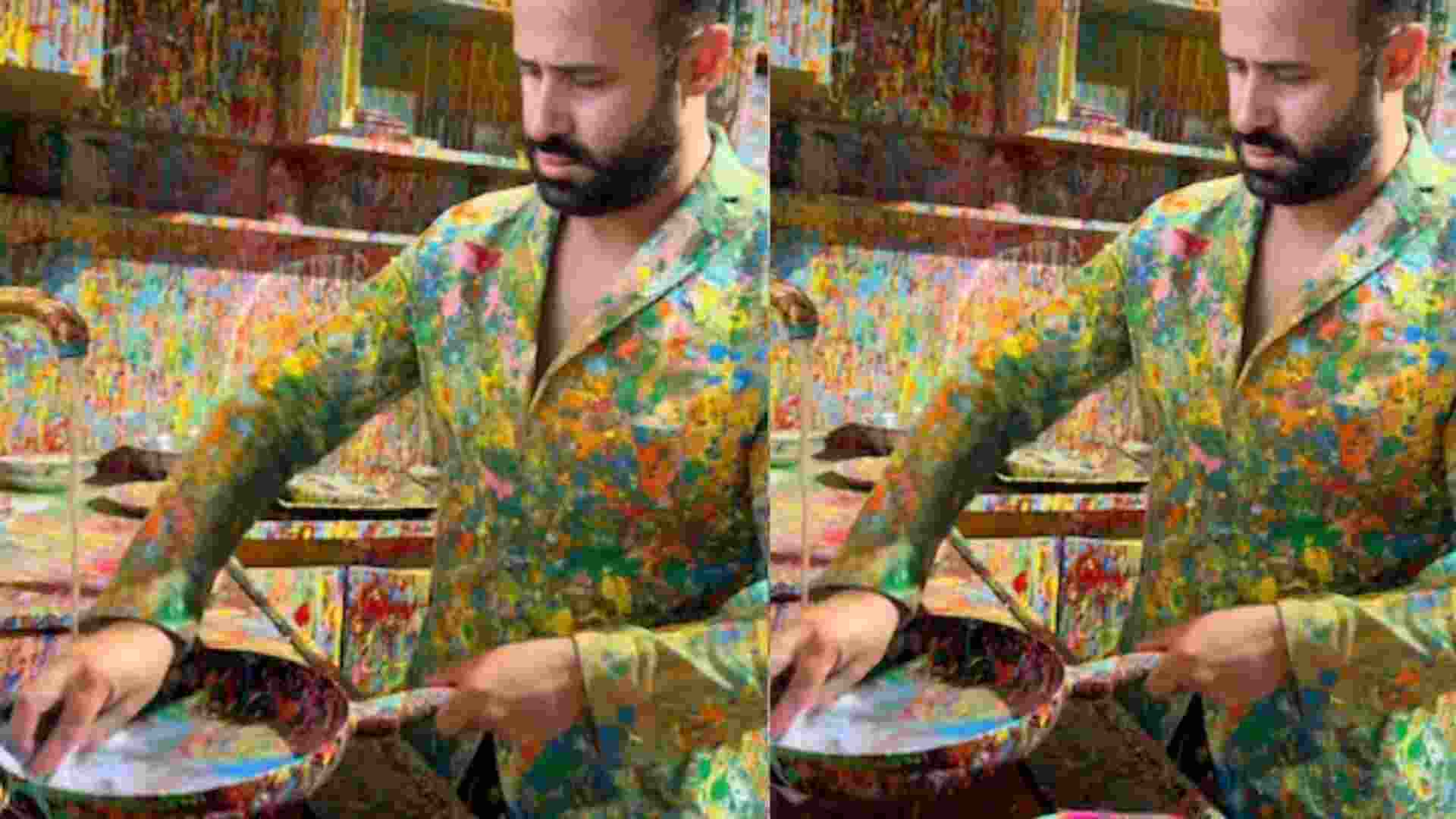 Man cleans his colorful kitchen