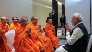 PM Modi Engages with Indian Diaspora and Receives Blessings from Buddhist Monks in Laos