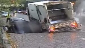 Watch: Mother And Son Rescued After Sinkhole Swallows Them In CCTV Footage