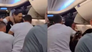 Passenger Tries to Open Emergency Door, Held Back by Crew : Watch