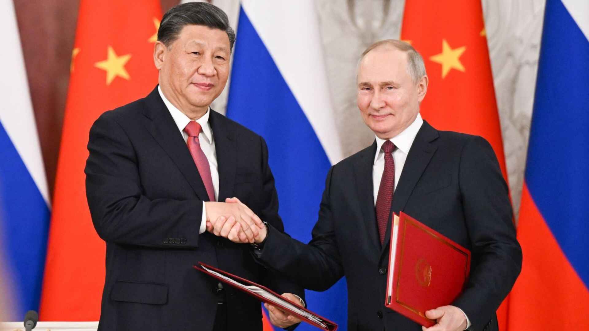 Xi Jinping and Vladimir Putin shaking hands during the former's visit to Moscow in March 2023