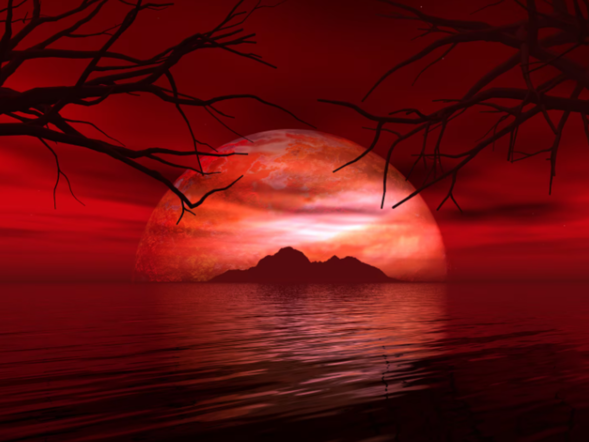 A glowing Blood Moon above a city skyline. - Photo Gallery