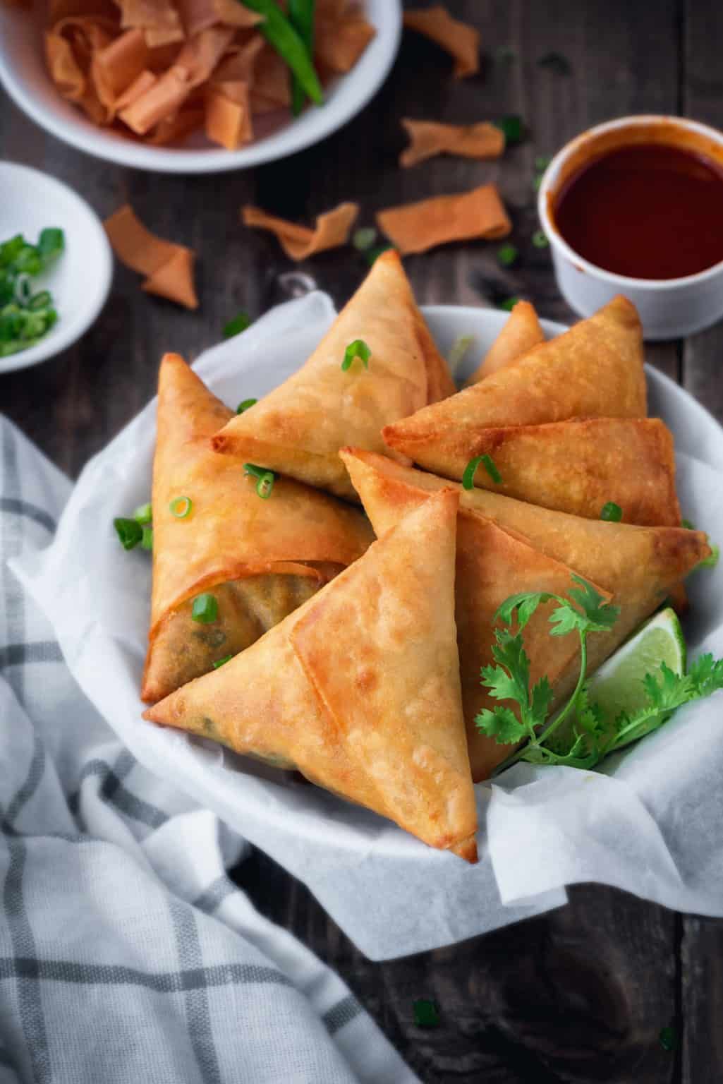 Global platter of samosas with international fillings and dips. - Photo Gallery