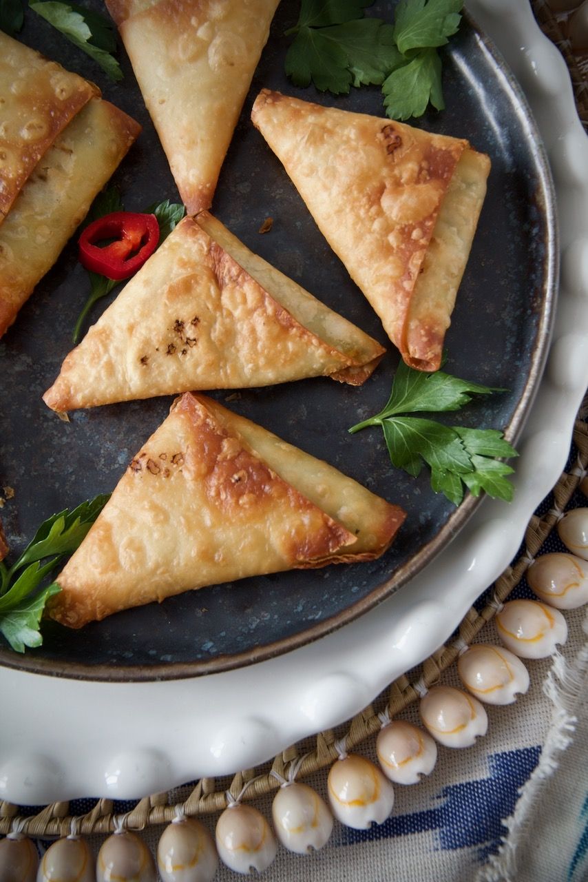 Artistic depiction of Persian cooks preparing stuffed pastries. - Photo Gallery