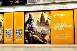 Sputnik India coils Delhi Metro's Yellow Line with their logos, slogans, and QR codes