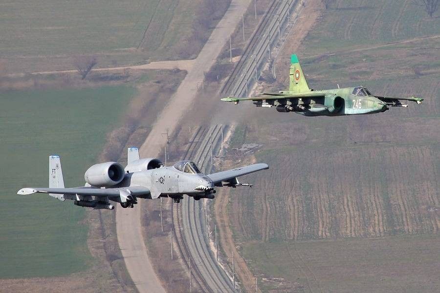 A dramatic scene showing the J-20 and Su-57 engaged in high-stakes aerial combat. - Photo Gallery