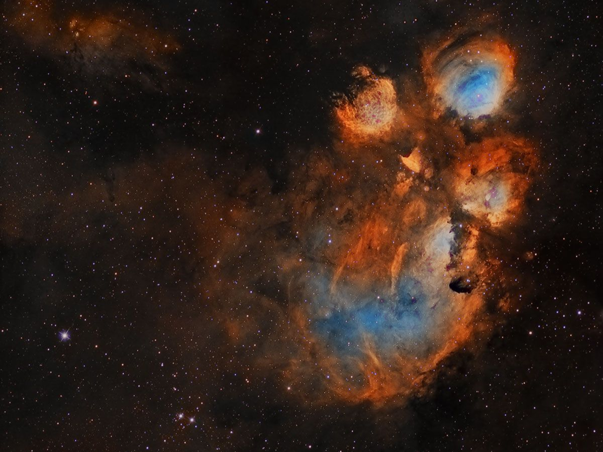 The Cat’s Paw Nebula glowing in fiery red clouds. - Photo Gallery