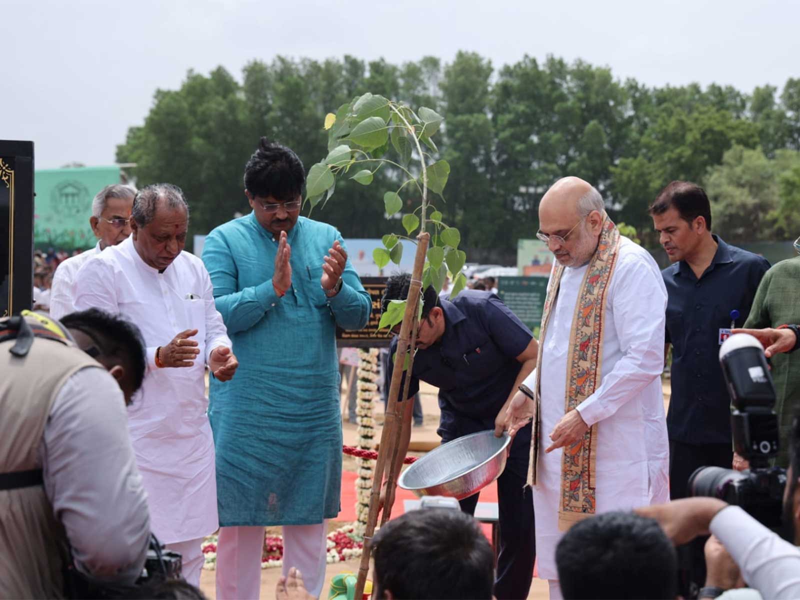 Union Home Minister Amit Shah plants trees (Photo/Gujarat CMO) Union Home Minister Amit Shah plants trees (Photo/Gujarat CMO)
