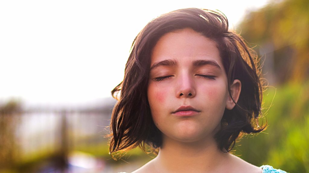 Woman with eyes closed visualising