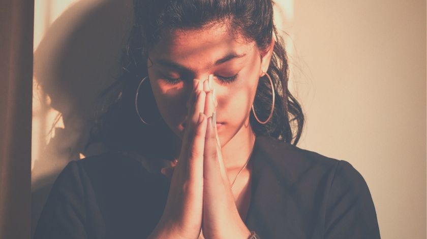 a woman in prayer 